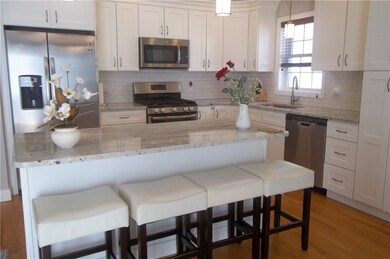 Granite counters, center island, white cabinets, s
