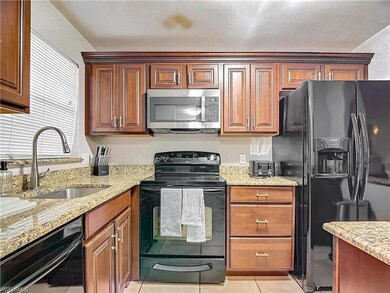 Kitchen with light tile patterned flooring, light 
