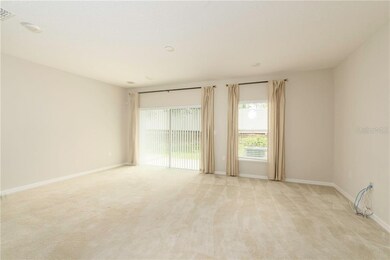 Living room, sliding doors to the Patio. Speaker w