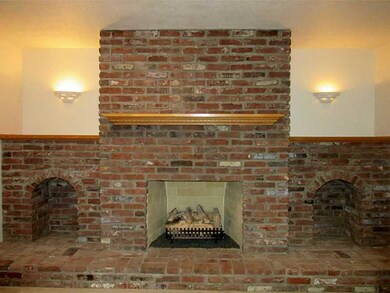Family Room. Stunning brick fireplace is focal poi