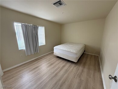 Bedroom with light hardwood / wood-style floors