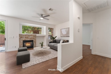 Living room with wood finished floors, baseboards,