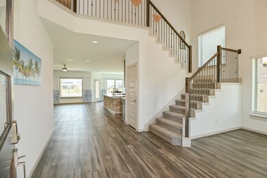 Soaring ceilings to the second floor at the Entry