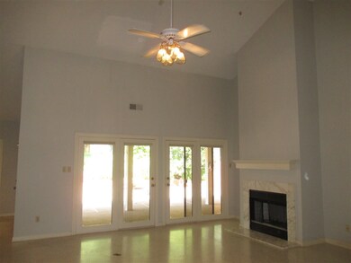 Mid-century tones with terrazzo floors, vaulted ce