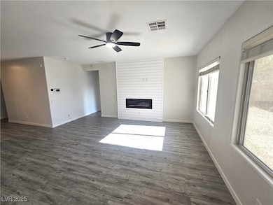Unfurnished living room featuring a large fireplac