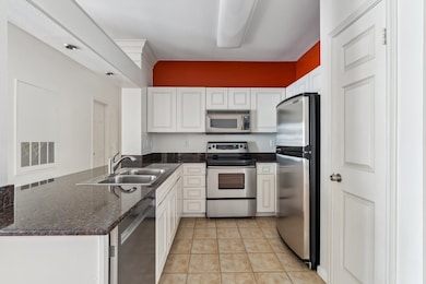 Updated kitchen featuring custom cabinet fronts, g