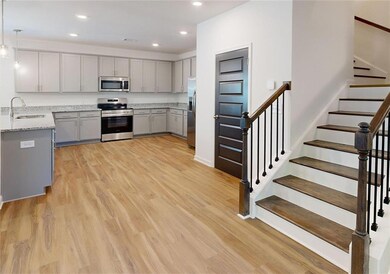 Kitchen with pendant lighting, stainless steel app