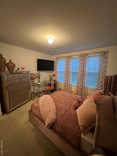 Bedroom with carpet flooring