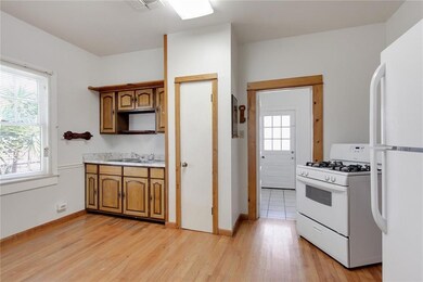 Kitchen with access to back yard.