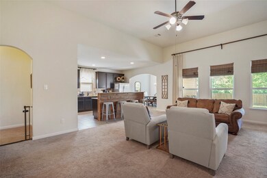 You can see into the kitchen from this shot and the hall on the left leads to two more secondary bedrooms and the other full bathroom.