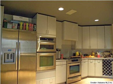 Gourmet kitchen with stainless appliances, custom 