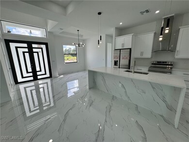 Kitchen with appliances with stainless steel finis
