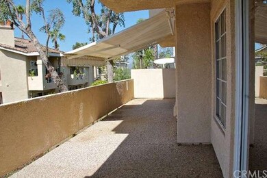 Expansive patio with a retractable awning and aggr