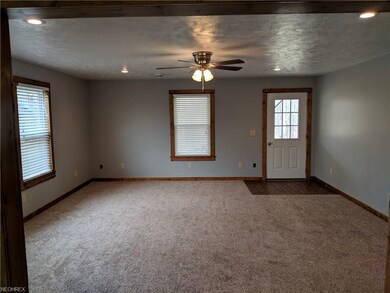 Living room.  New paint. New Carpet. New blinds. D