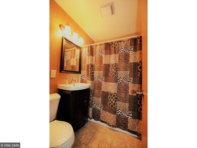 Updated ML bath with ceramic tile floor.
