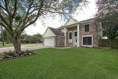 An immaculate front lawn and beautiful landscaping provide great curb appeal.