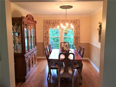 Big and bright dining room with hardwood floors...