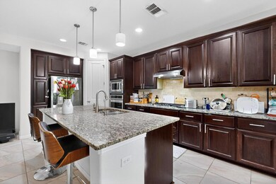 Kitchen with light stone countertops, decorative 