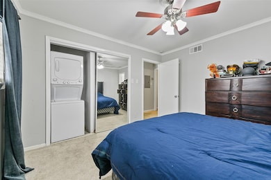 Bedroom featuring crown molding, ceiling fan, elec