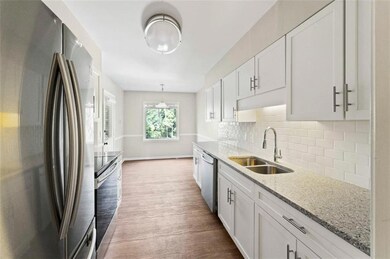 Kitchen with hardwood / wood-style flooring, taste