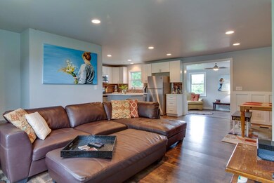 Open floor plan that flows from the living room to the kitchen,  