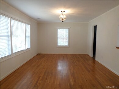 Large living room with hardwood floors, new paint