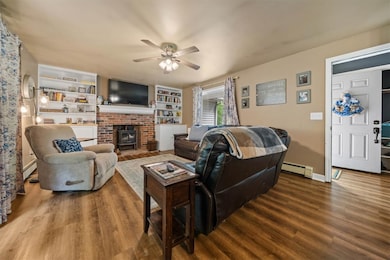 Cozy family room w/ wood stove-insert and custom b