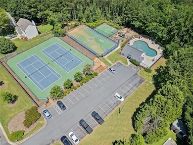 Aerial view of a pool area and a forest
