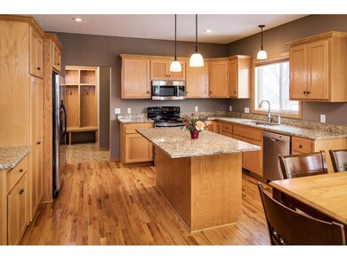 The kitchen has granite counter tops and stainless