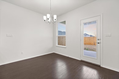 Unfurnished dining area featuring a chandelier, d