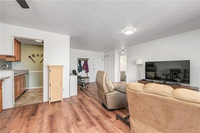 Hardwood floored living room featuring a textured 