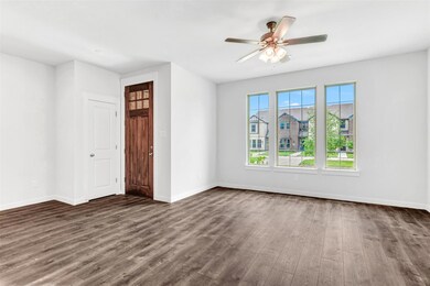 Spare room with ceiling fan and wood-type flooring