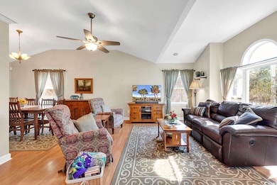 Living room with a wealth of natural light and vin