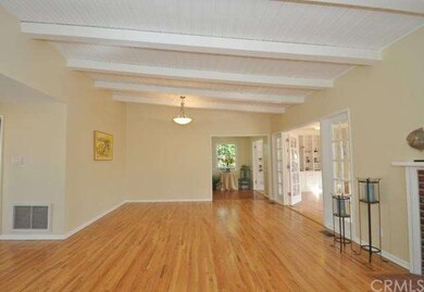 Living Room towards the Kitchen and Sun Room to th