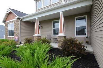 Gorgeous wide open porch welcomes as you pass the 