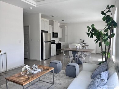 Living area with wood finished floors and baseboards