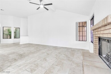 Unfurnished living room featuring a fireplace, bas