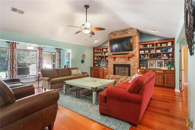 Living room with view to the back yard and patio