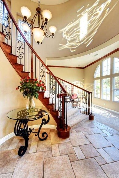 Formal Entry with Wrought Iron Staircase