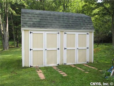 Backyard. EXTRA LARGE STORAGE SHED....