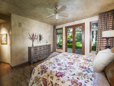 Master bedroom with french doors leading