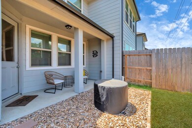 Take a look at the fenced backyard, where a covere