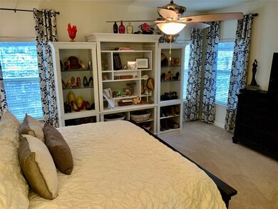 Bedroom with carpet flooring and baseboards