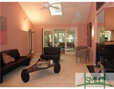 Living Room. Has new white carpet , ceiling fan an
