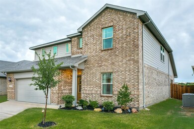 View of front of property featuring a garage, cent