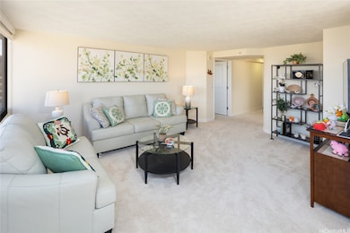 View of living room from the viewpoint of the dining room.  Primary bedroom is through the white door in the background.