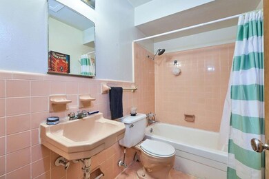 Full bathroom with shower / bath combination with 