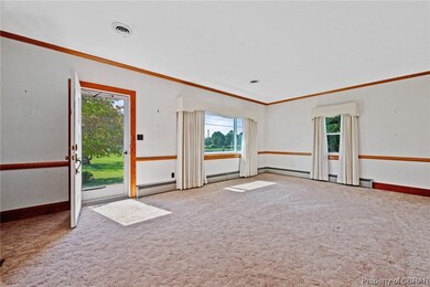 Carpeted spare room with a wealth of natural light