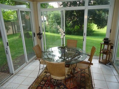 This wonderful sunporch features sliders on each s