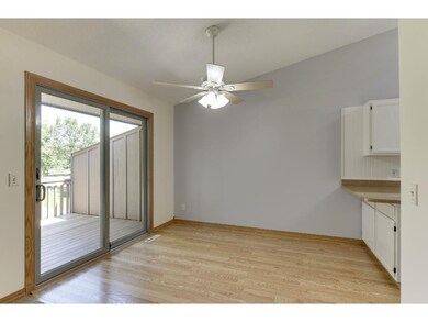 Dinng room features hardwood floor, ceiling fan an